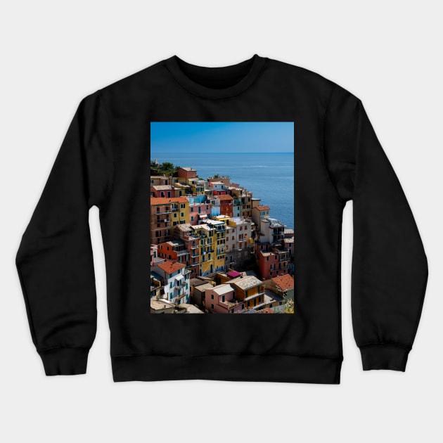 View on the cliff town of Manarola, one of the colorful Cinque Terre on the Italian west coast Crewneck Sweatshirt by Dolfilms